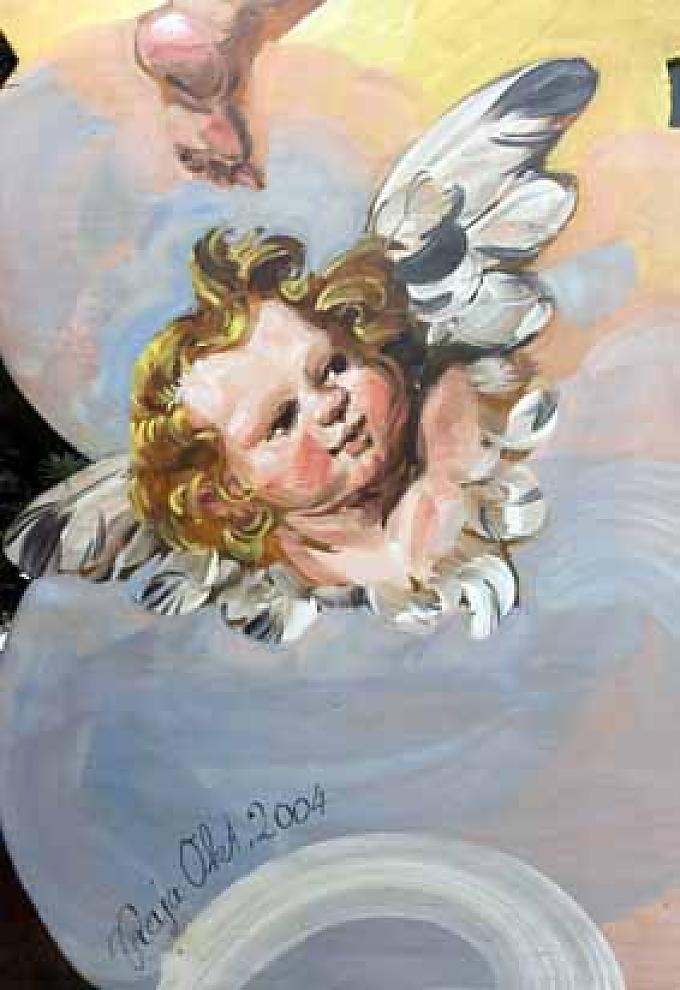 Barocke Putte an einem Stand Besucher auf dem St. Gilgener Adventsmarkt