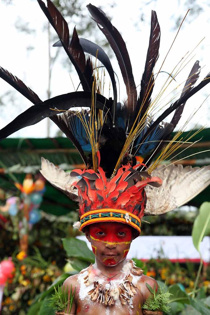 Traditionell geschmücktes Kind aus Rukus Traditionell geschmücktes Kind aus Rukus