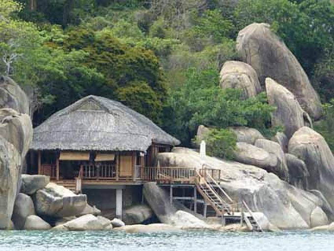 Strandvilla im Six Senses Ninh Van Bay Umladen von Bananen auf dem Floating Market von Cai Be